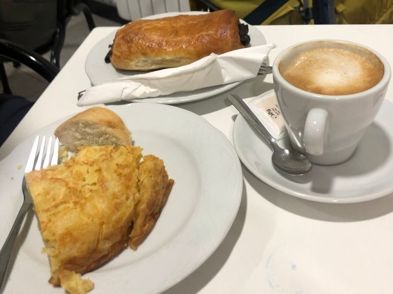 Spanish "tortilla" (egg, potato, onion pie), pan au chocolat, and café latte