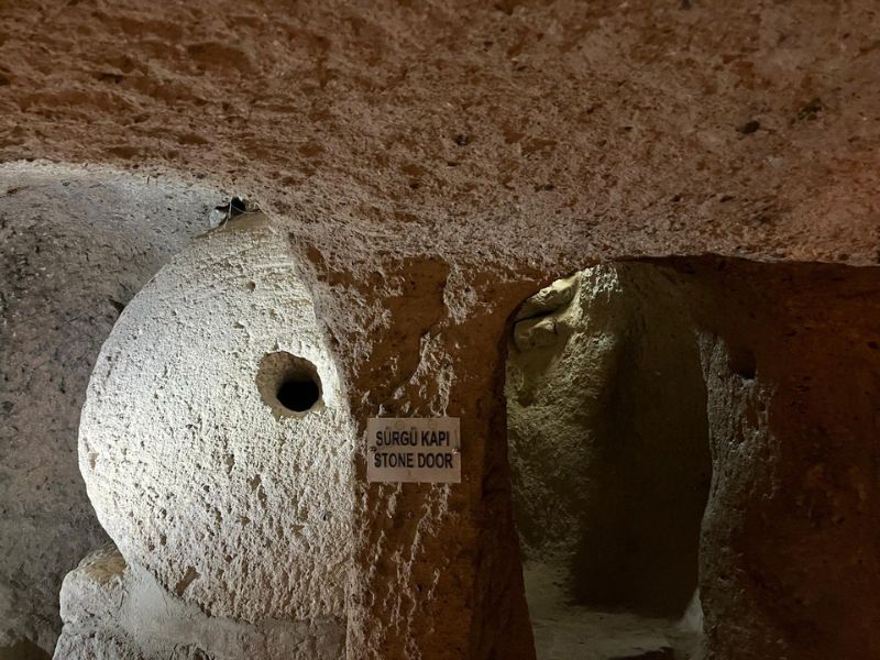 Stone door could be rolled to block passage.