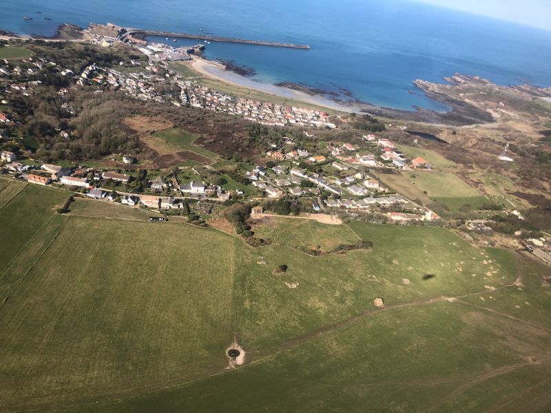 Braye Bay, with the breakwater and harbour on the left