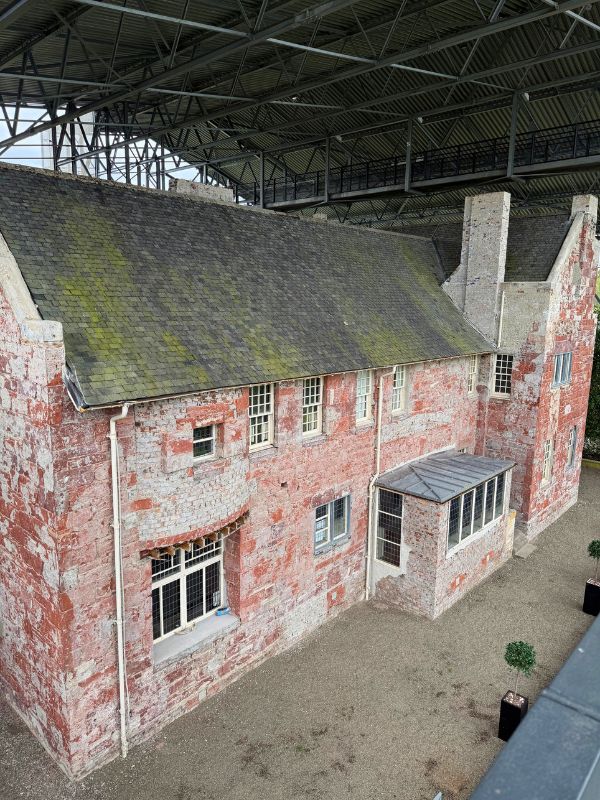 Hill House has been covered since 2018 while they painstakingly chipped off the cement skin that had sealed in moisture, causing mold damage.